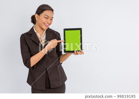 asian woman in formal outfit pointing on the digital tablet with green screen 99819195