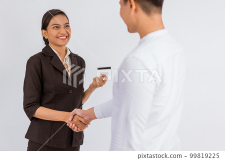 asian woman hand shake with the man while holding the blank card 99819225