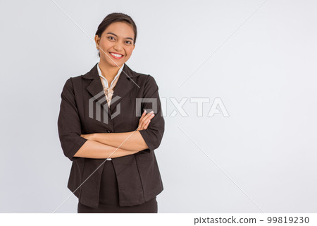 asian woman in formal outfit standing with handcrossed asian woman in formal outfit standing with handcrossed 99819230