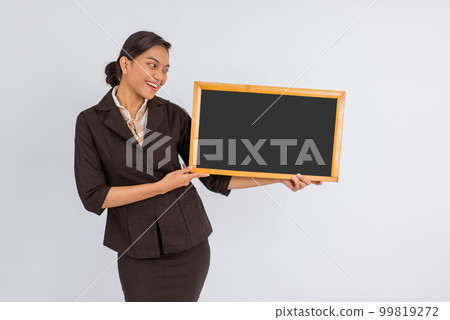 beautiful woman in formal outfit showing the blackboard 99819272