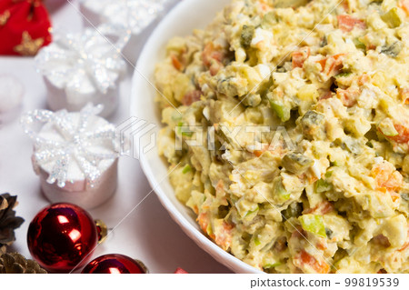 Olivier Russian salad on a Christmas and New Year background, top view. 99819539