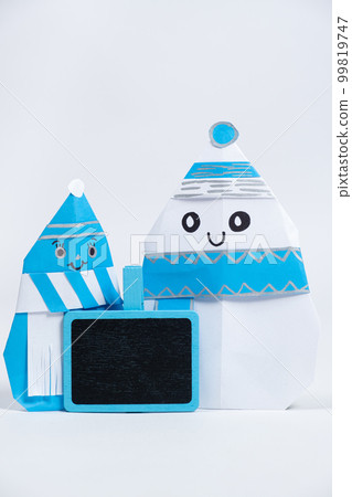 Two paper snowmen origami, place for text. Crafts for Christmas and New Year. 99819747