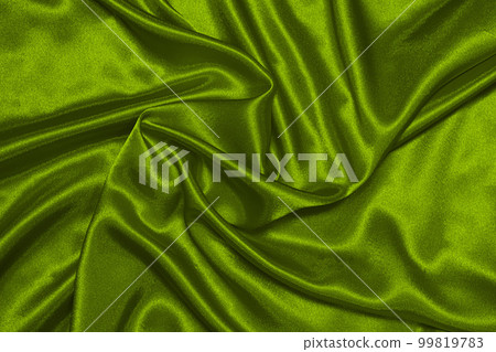 Texture of crumpled green olive satin fabric, beautiful pattern, top view. Texture of crumpled green olive satin fabric, beautiful pattern, top view. 99819783