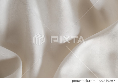 Abstract beige fabric background, satin stripe texture, wavy folds of elegant expensive fabric 99819867