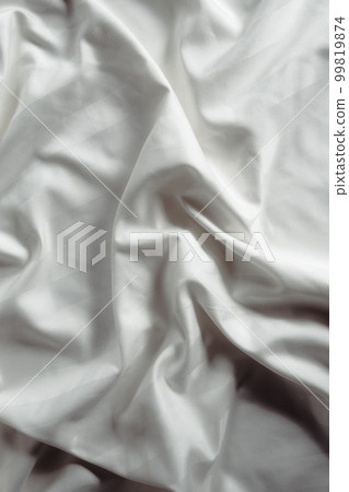 Light grey abstract background, satin texture, wavy fabric folds 99819874