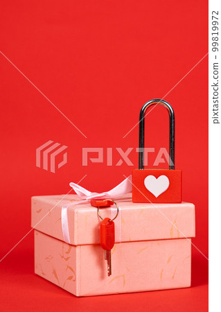 Valentine's Day Card - lock with keys on a gift box on a red background, a place for text Valentine's Day Card - lock with keys on a gift box on a red background, a place for text 99819972