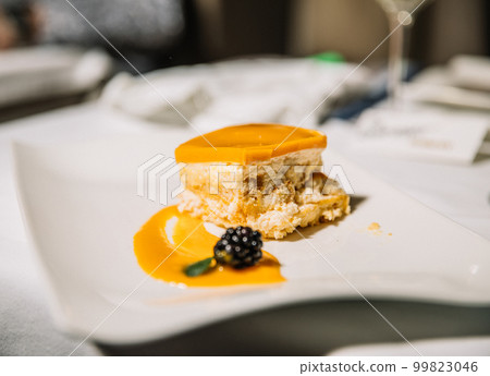 Delicious dessert of biscuit, manco, nuts and cream, restaurant concept Delicious dessert of biscuit, manco, nuts and cream, restaurant concept 99823046