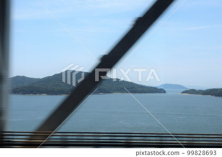 Traveling from Okayama to Takamatsu by JR through the Seto Ohashi Bridge and crossing the Seto Inland Sea in July Traveling from Okayama to Takamatsu by JR through the Seto Ohashi Bridge and crossing the Seto Inland Sea in July 99828693