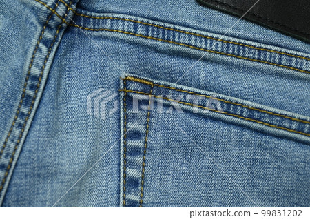 stitch on blue jeans textile 99831202