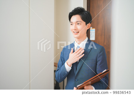 A young businessman who does door-to-door sales 99836543