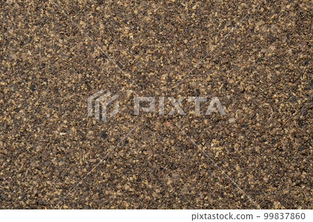 Poured ground black pepper background. Dry seasoning pepper. Spices and herbs for cooking, pepper powder Poured ground black pepper background. Dry seasoning pepper. Spices and herbs for cooking, pepper powder 99837860