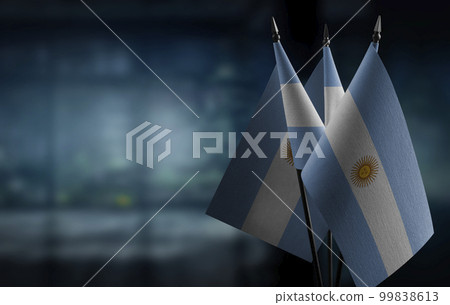 A small Argentina flag on an abstract blurry background A small Argentina flag on an abstract blurry background 99838613
