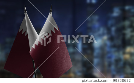 Small flags of the Qatar on an abstract blurry background 99838652
