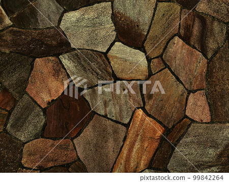 Background image of a dark ocher rough paving stone surface 99842264