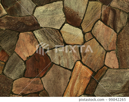 The background image of the surface of the ocher rough paving stones 99842265