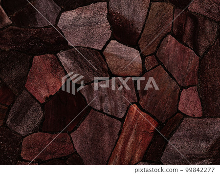 Background image of a dark, dark reddish-brown, rough, irregular paving stone surface Background image of a dark, dark reddish-brown, rough, irregular paving stone surface 99842277