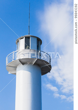 White lighthouse tower is under blue sky on a daytime, port of Varna White lighthouse tower is under blue sky on a daytime, port of Varna 99843192