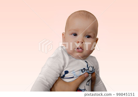 Little cuty baby is being lifted in to the air by his father 99845151