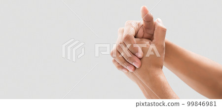 A man cracking their knuckles A man cracking their knuckles 99846981