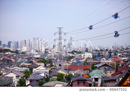 Looking towards Shinjuku from Tokyo's Suginami Ward, Lineman Steel towers, men protecting power lines and electricity Looking towards Shinjuku from Tokyo's Suginami Ward, Lineman Steel towers, men protecting power lines and electricity 99847502