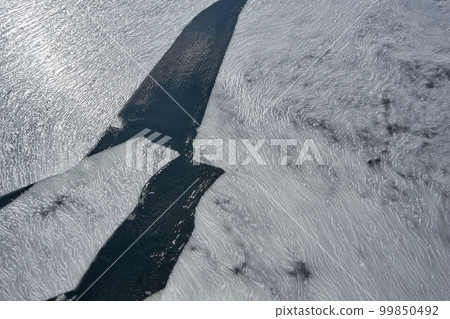 Hokkaido Drift ice on the Abashiri River seen from a boat 99850492