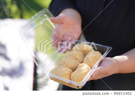 Woman with homemade kinako ohagi 99851402
