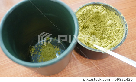 Conveyor-belt sushi cup with powdered green tea Conveyor-belt sushi cup with powdered green tea 99851426