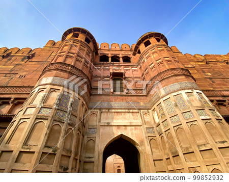 The famous red fort in the city of Agra, India. Tourists visit a popular tourist attraction. The famous red fort in the city of Agra, India. Tourists visit a popular tourist attraction. 99852932