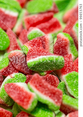 Texture background with watermelon shaped jelly candies. Texture background with watermelon shaped jelly candies. 99853763