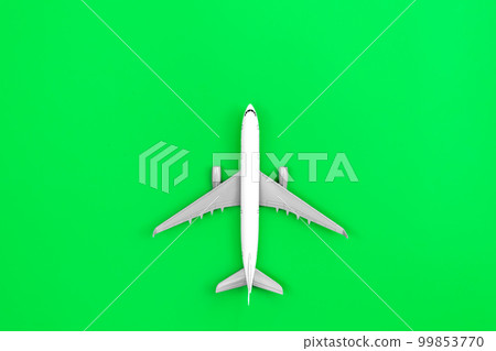 White plane, airplane on a green background, flat lay. 99853770