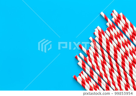 Drinking straws for party on blue background, flat lay, copy space. 99853954