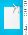 A plane, airplane on a blue background, flat lay, copy space. 99854015