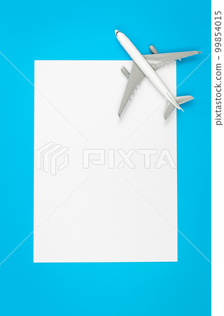 A plane, airplane on a blue background, flat lay, copy space. A plane, airplane on a blue background, flat lay, copy space. 99854015
