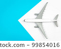 A plane, airplane on a blue background, flat lay, copy space. 99854016