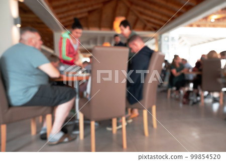 Blurred Shot Of Beach Cafe Where People Eat. Blurred Shot Of Beach Cafe Where People Eat. 99854520