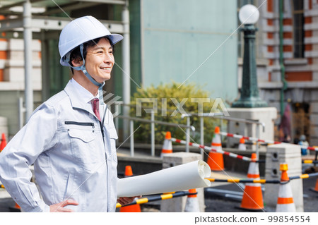 Site supervisor standing at the construction site 99854554
