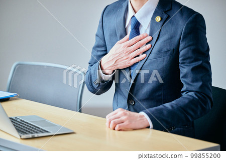 young lawyer with hand on chest 99855200