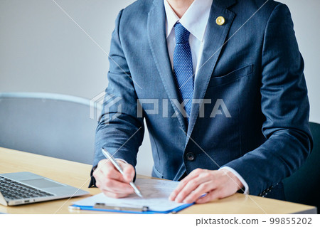 Young lawyer interviewing client at legal consultation 99855202