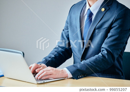 young lawyer typing on a computer 99855207
