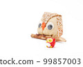 Owl figurine perched on a tree 99857003