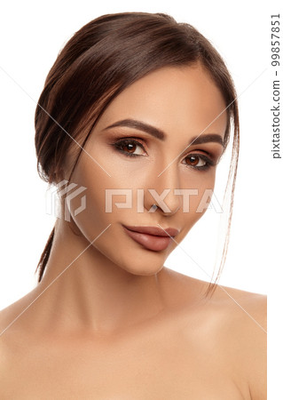 Close up portrait of a brunette nude model girl... - Stock Photo