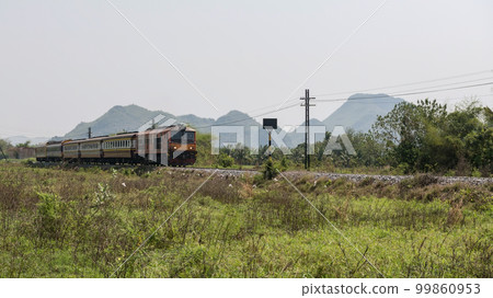 Classic train on railway in Kanchanaburi, Thailand 99860953