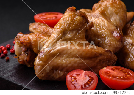 Baked chicken wings with salt, spices and herbs 99862763