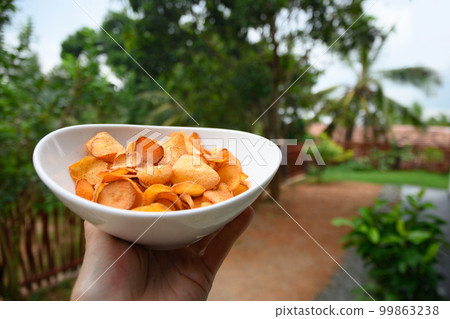 Organic Cassava chips. Indonesia popular hot spicy snacks. 99863238