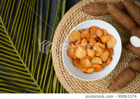 Organic Cassava chips in bowl. Indonesia popular hot spicy snacks. Top view . 99863374
