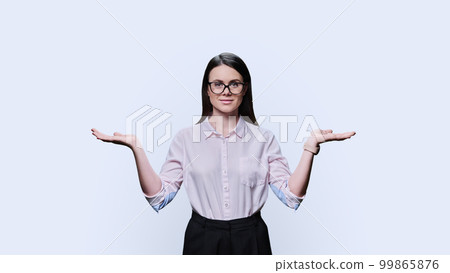 Business woman holding two hands with empty open palms on white background 99865876
