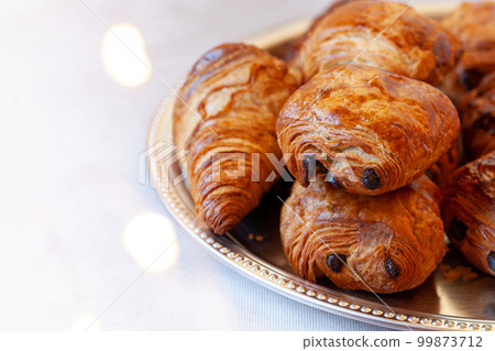 Pain au chocolat, french sweet pastry speciality 99873712
