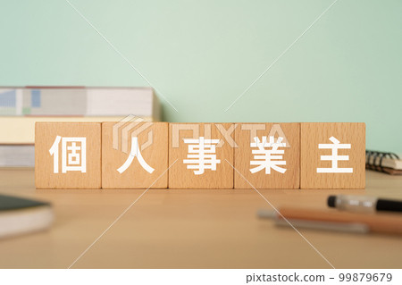 A desk with a block written as a sole proprietor 99879679