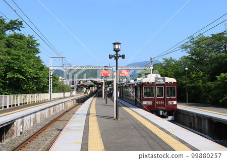 Hankyu 6300 series train stopping at Arashiyama station 99880257