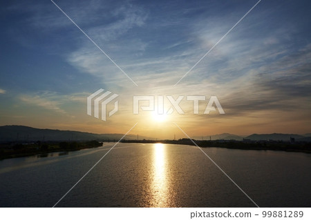 A spring morning sky with various clouds and a river that reflects the sky ・220502am A spring morning sky with various clouds and a river that reflects the sky ・220502am 99881289